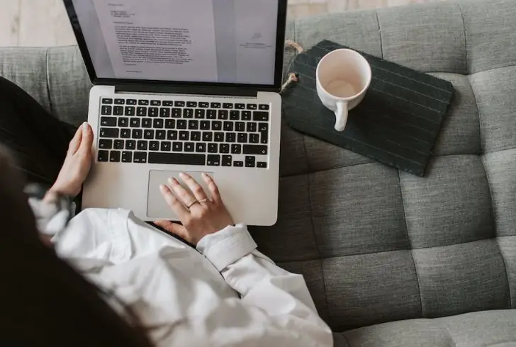 A person with a laptop in a flexible work environment.