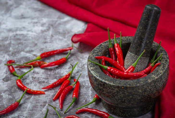 Chili peppers offer both potential health benefits and drawbacks.