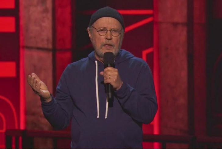 Billy Crystal speaks with emotion on stage.