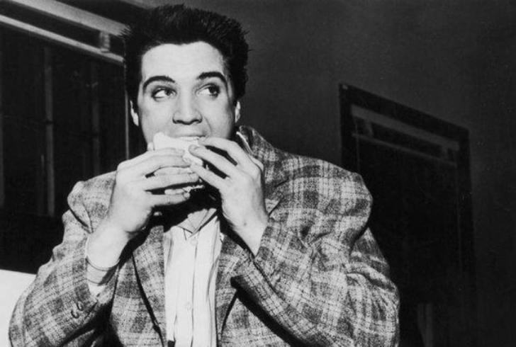 Elvis Presley enjoyng burger from Krystal burgers